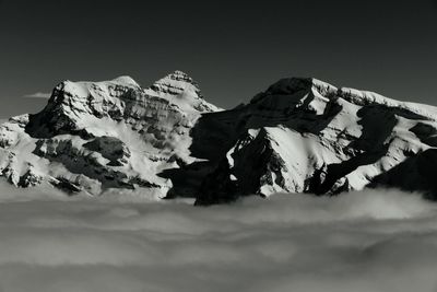 Scenic view of snow covered mountains