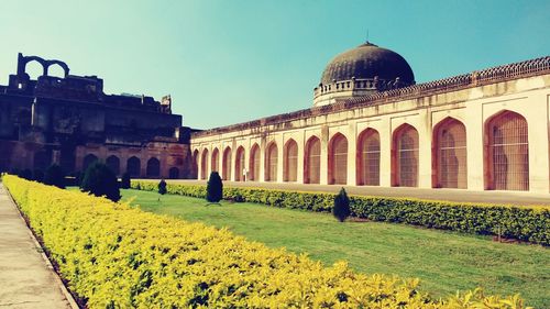 Low angle view of historical building against clear sky on sunny day