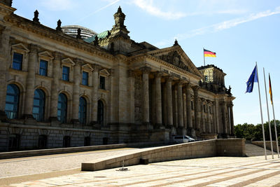 View of historical building in city against sky