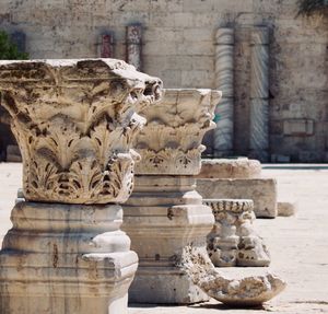 Statue against historic building