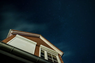 Low angle view of building against sky at night