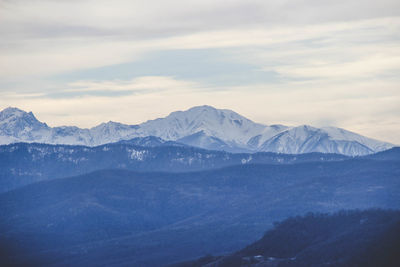 Scenic view of snowcapped mountains against sky