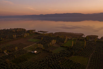 High angle view of agricultural landscape during sunset