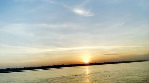 Scenic view of sea against sky at sunset