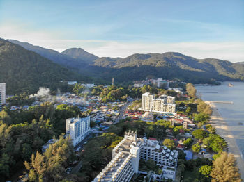 High angle view of townscape and mountains against sky