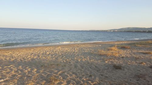 Scenic view of beach against clear sky