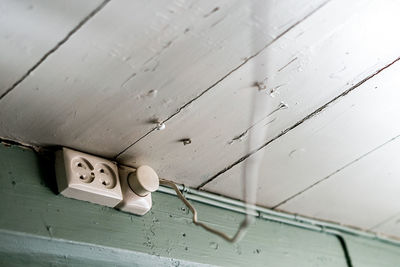 Close-up of telephone booth on wall