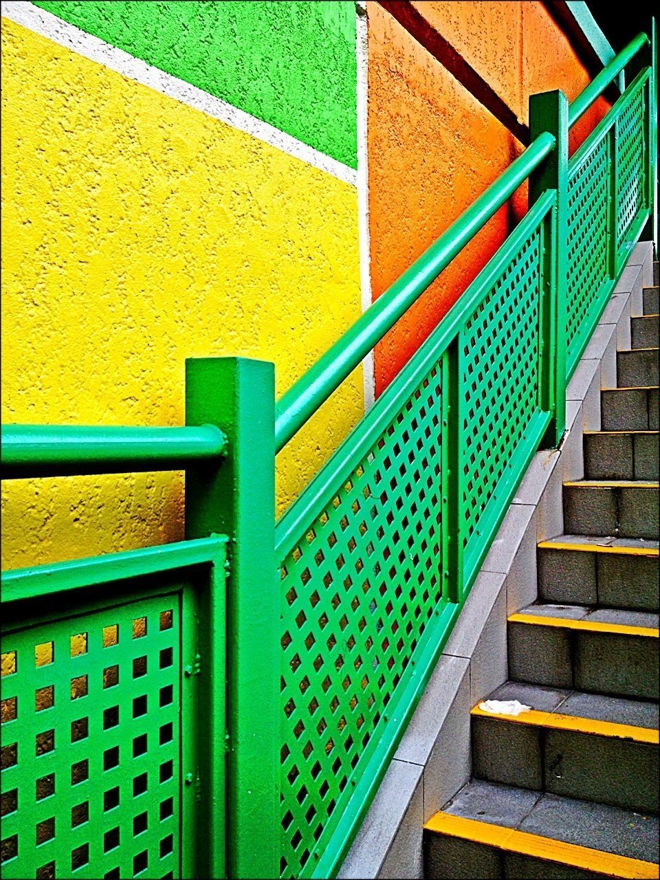 railing, built structure, architecture, pattern, steps, steps and staircases, wall - building feature, full frame, blue, staircase, metal, green color, multi colored, backgrounds, design, no people, building exterior, high angle view, yellow, day
