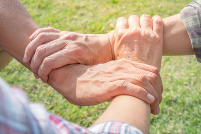 Midsection of man holding hands