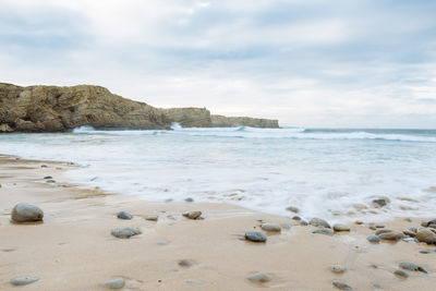 Scenic view of beach against sky