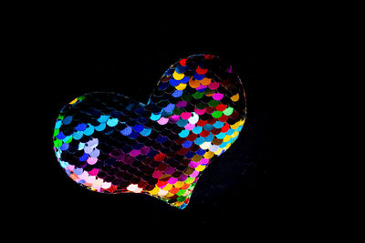 Close-up of heart shape against black background