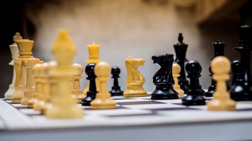 Close-up of chess board on table