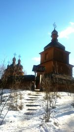 Built structure against clear blue sky during winter