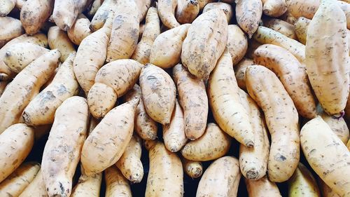 Full frame shot of sweet potatoes for sale at market stall