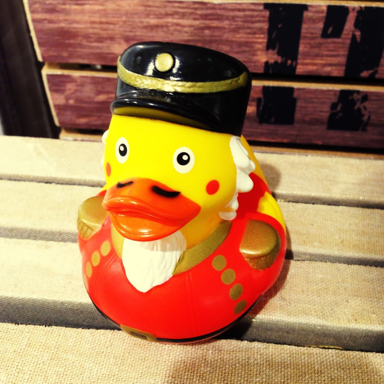 indoors, still life, toy, table, close-up, art, art and craft, animal representation, creativity, human representation, anthropomorphic face, childhood, red, multi colored, no people, high angle view, yellow, single object, wood - material, plastic