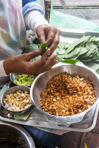 High angle view of man preparing food on table