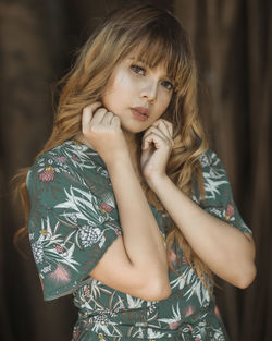 Portrait of young woman standing outdoors