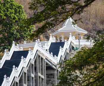 Octagonal cement pavilion resting on the hill.