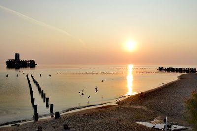 Scenic view of sea against sky during sunset