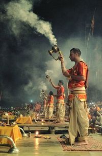 Full length of men standing at night