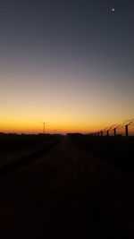 Scenic view of landscape against sky at sunset