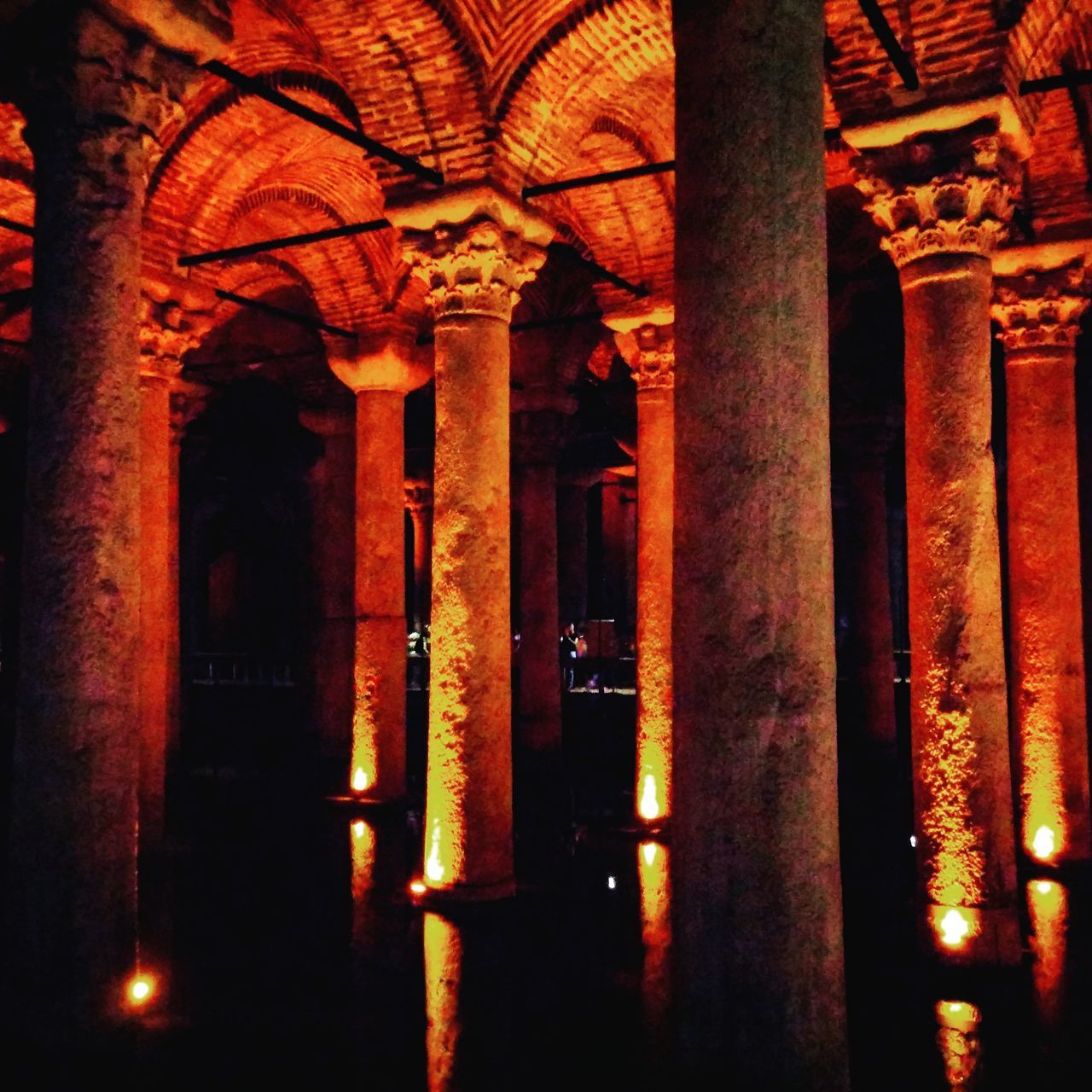 architecture, built structure, arch, architectural column, history, illuminated, indoors, column, religion, building exterior, famous place, travel destinations, place of worship, night, orange color, tourism, low angle view, colonnade, spirituality, in a row