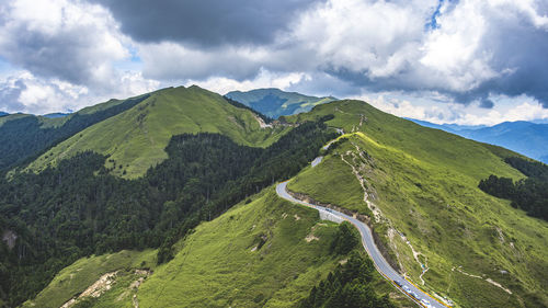 Panoramic view of green landscape against sky