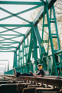 Portrait of young man on bridge