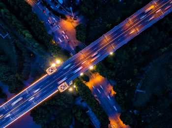 High angle view of light trails on road at night