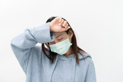 Portrait of a beautiful young woman over white background