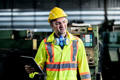 Full length of man working with mobile phone