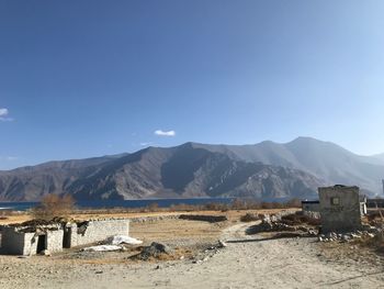 Scenic view of mountains against clear blue sky