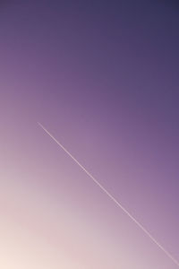 Low angle view of vapor trail