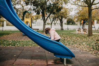 Side view of child in park