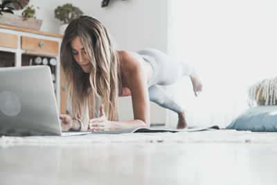 Woman exercising at home