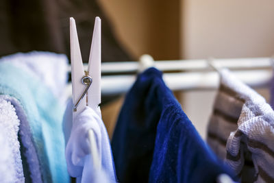 Close-up of clothes drying on rack