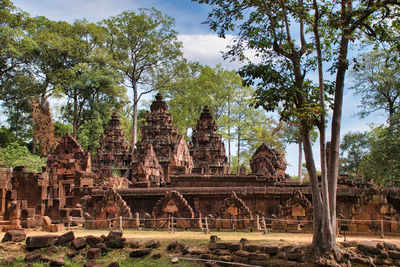 Old temple against trees