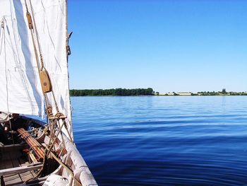 View of calm sea against clear blue sky