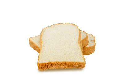 Close-up of fresh bread against white background