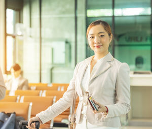 Portrait of young woman standing in gym