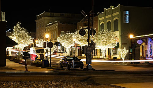 Illuminated street and buildings at night