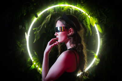 Portrait of young woman wearing sunglasses