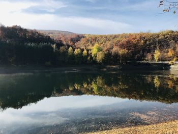 Scenic view of lake against sky during autumn