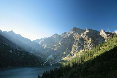 Scenic view of mountains against clear blue sky