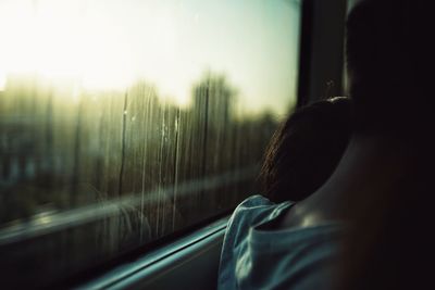 Cropped image of couple in train