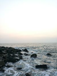 Scenic view of sea against clear sky during sunset