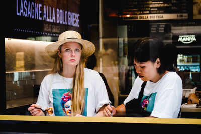 Portrait of friends standing in store