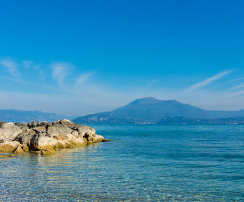 Scenic view of sea against blue sky