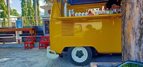 Yellow cart on street in city