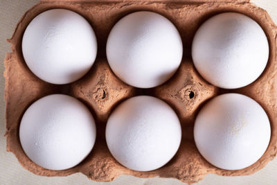 Directly above shot of eggs in container